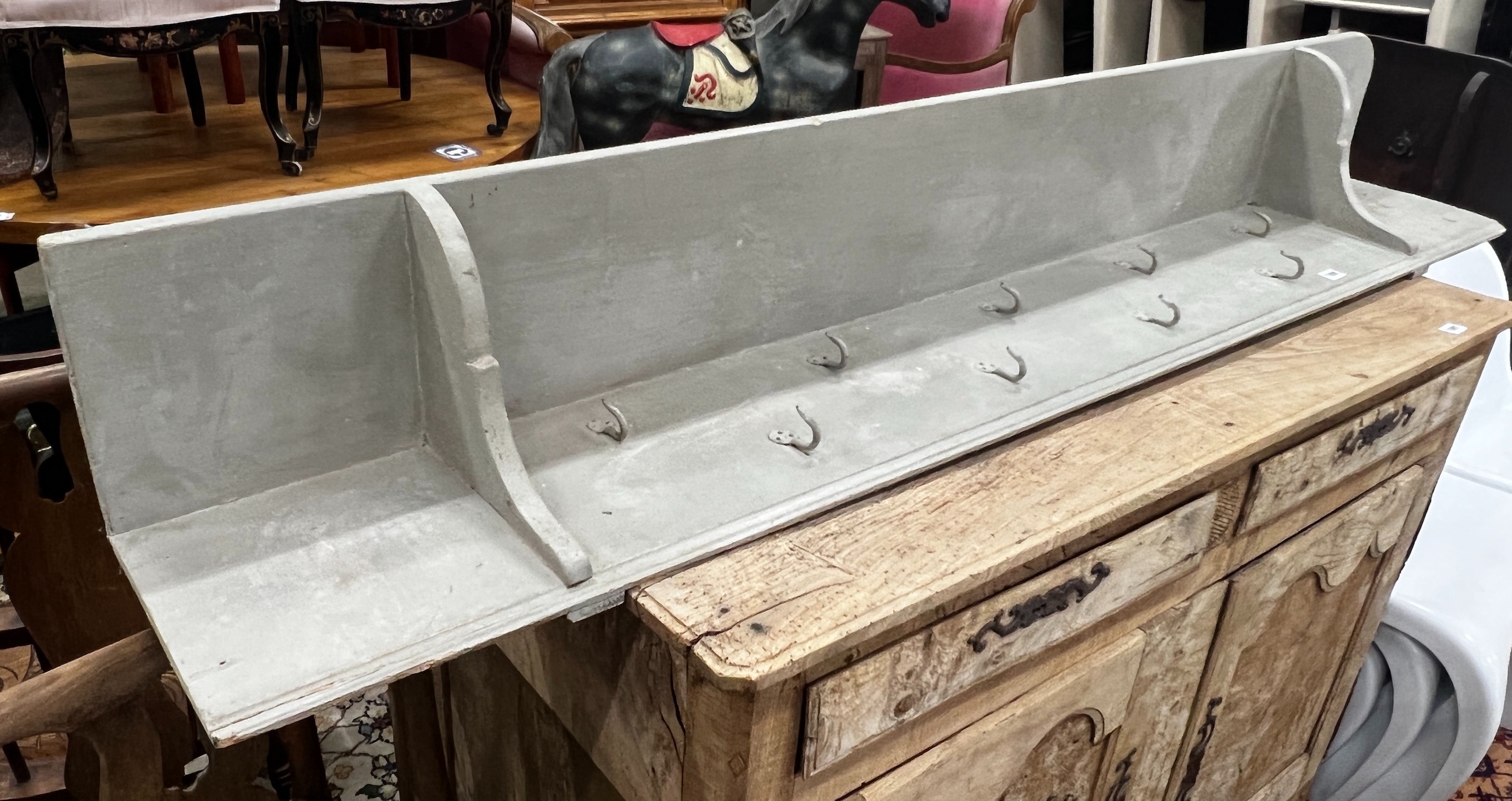 A painted hanging coat rack with wrought iron hooks, length 182cm, height 28cm